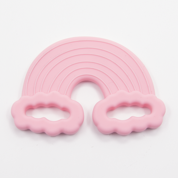 Taffy pink rainbow teething toy. White background. 