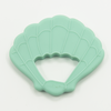 Tropical seashell teether, white background. 