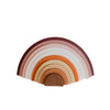 Silicone rainbow stacker . White background. Muted brown, tans, oranges, pinks. 10 pcs