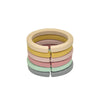 Stack of six link rings, one of each color. White background. 