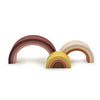 Silicone rainbow stacker . White background. Muted brown, tans, oranges, pinks. 10 pcs