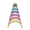 Pastel rainbow stacker. Seven pieces stacked. White background. 