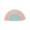 Pastel rainbow stacker. Seven pieces. White background. 