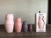 One Set of cat nesting dolls. 4 dolls next to each other. Shows packaging. 