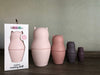 One Set of cat nesting dolls. 4 dolls next to each other. one more set inside packaging. 